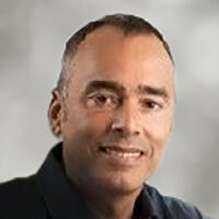 headshot of doctor dennis gilbert from babson's board of directors