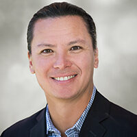headshot of babson's founder, chief operating officer, and chairman, eric olson