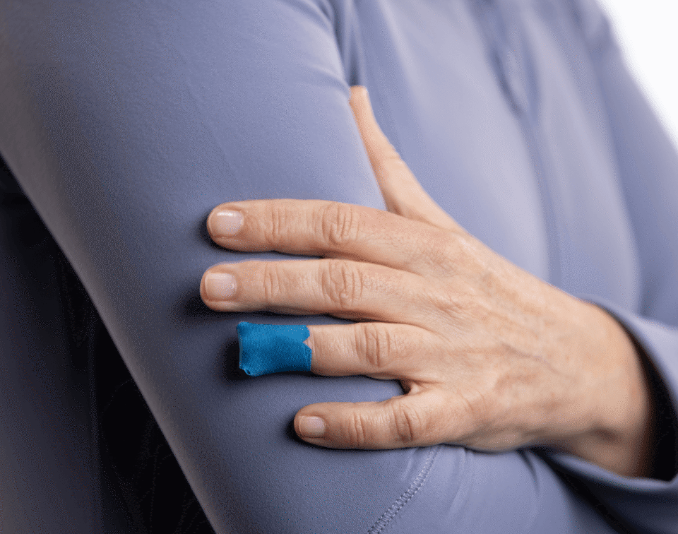 patient with a small bandage on their finger after being tested by a blood test company