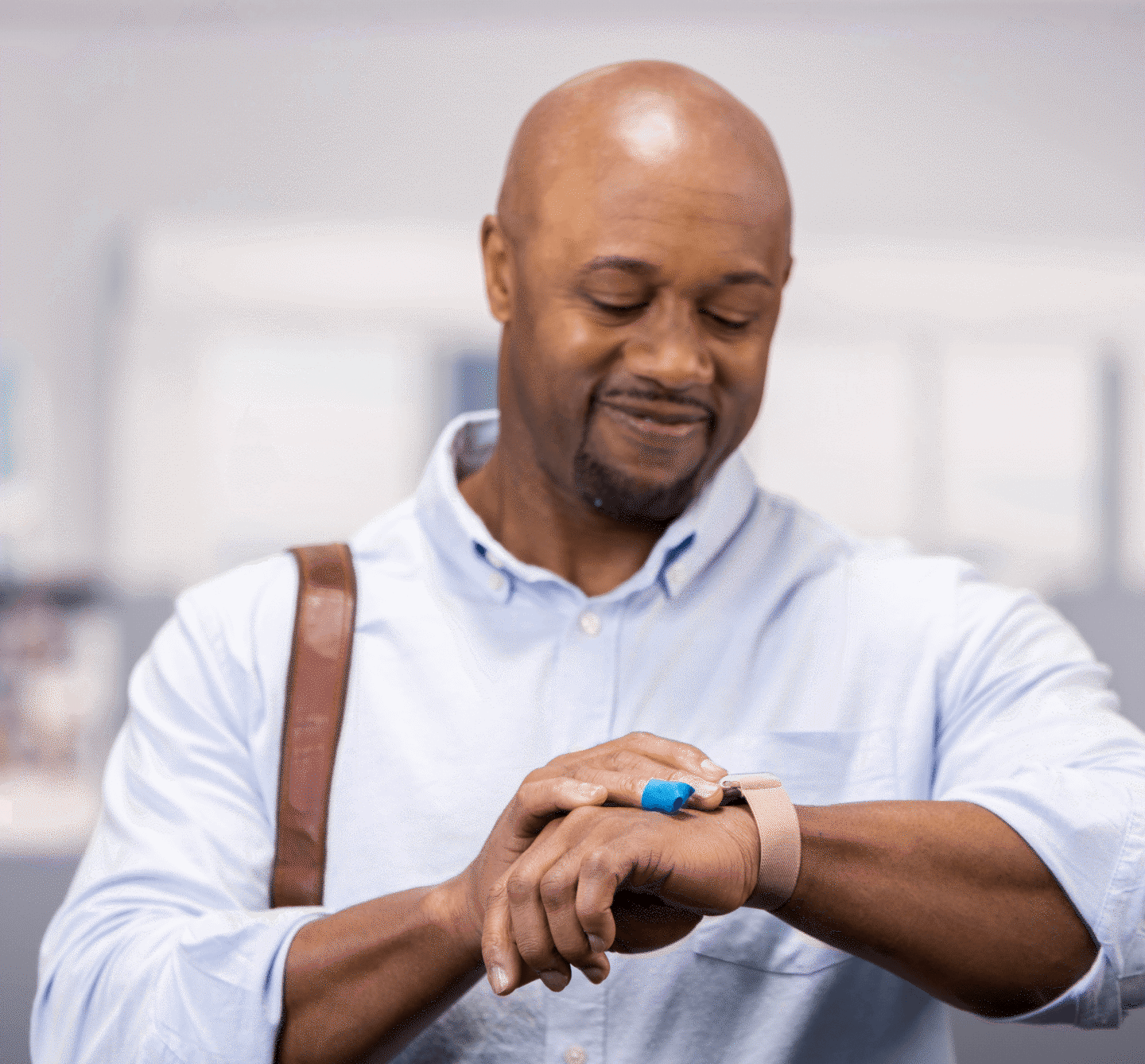 babson patient smiling and looking at his watch